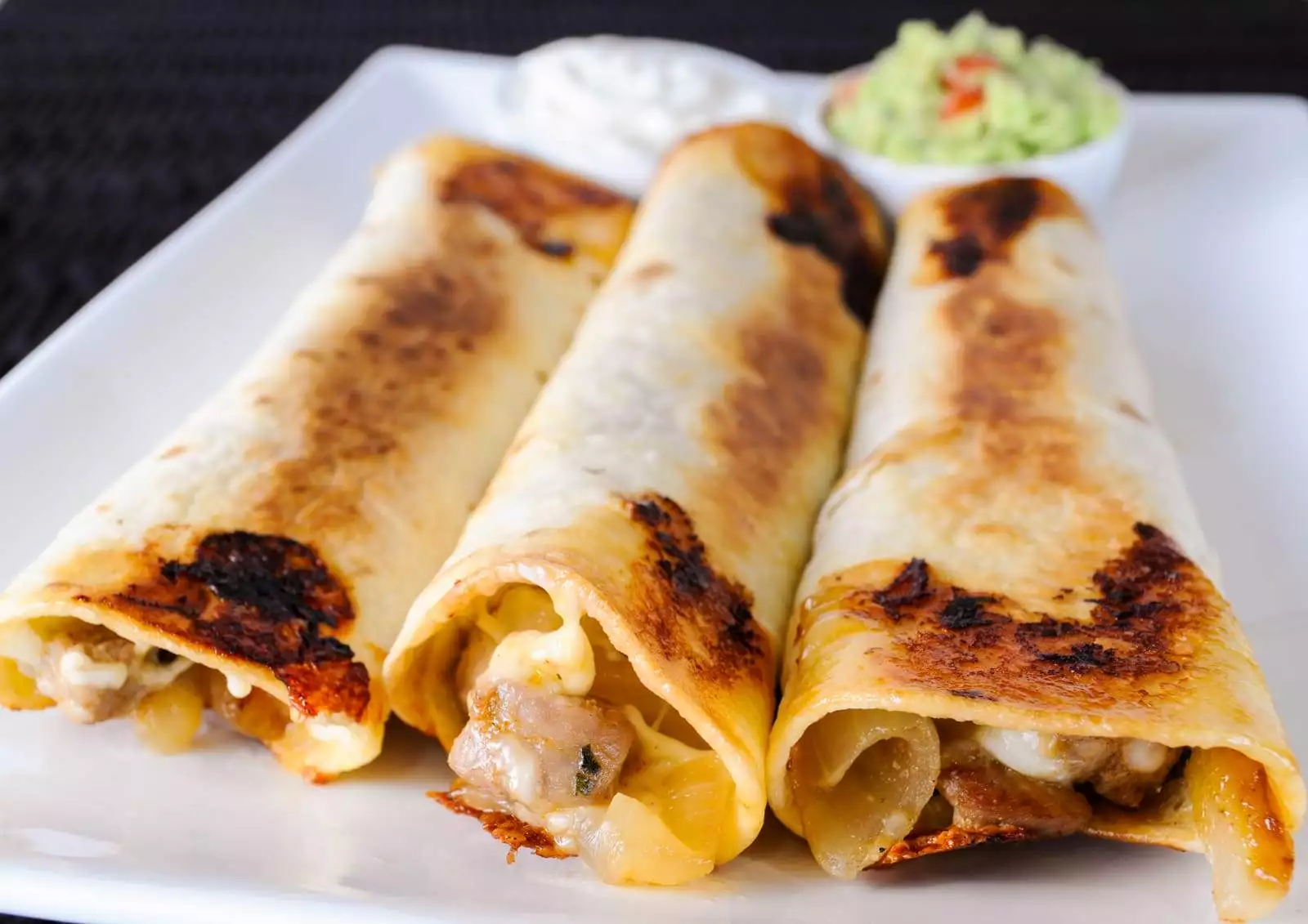 Pork Tenderloin, Caramelized Onion, and Monterey Jack Baked Flautas