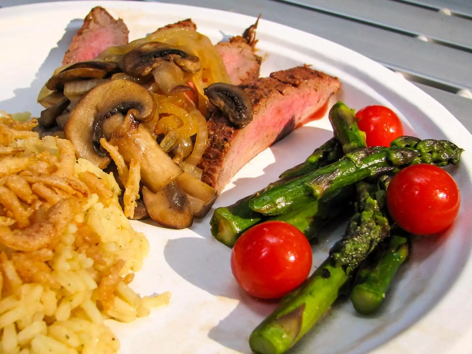 Camping Cuisine - Flank Steak with Caramelized Onions and Mushrooms alongside Asparagus and Tomatoes