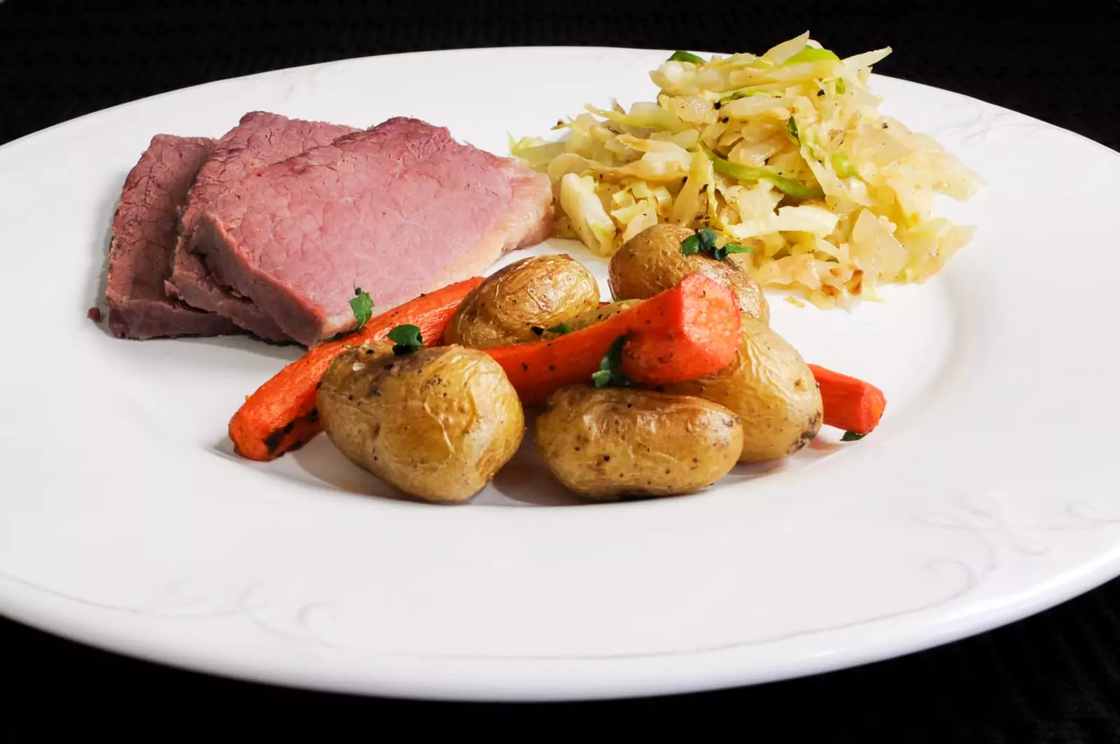 Corned Beef, Sautéed Cabbage and Onions, and Roasted Potatoes and Carrots