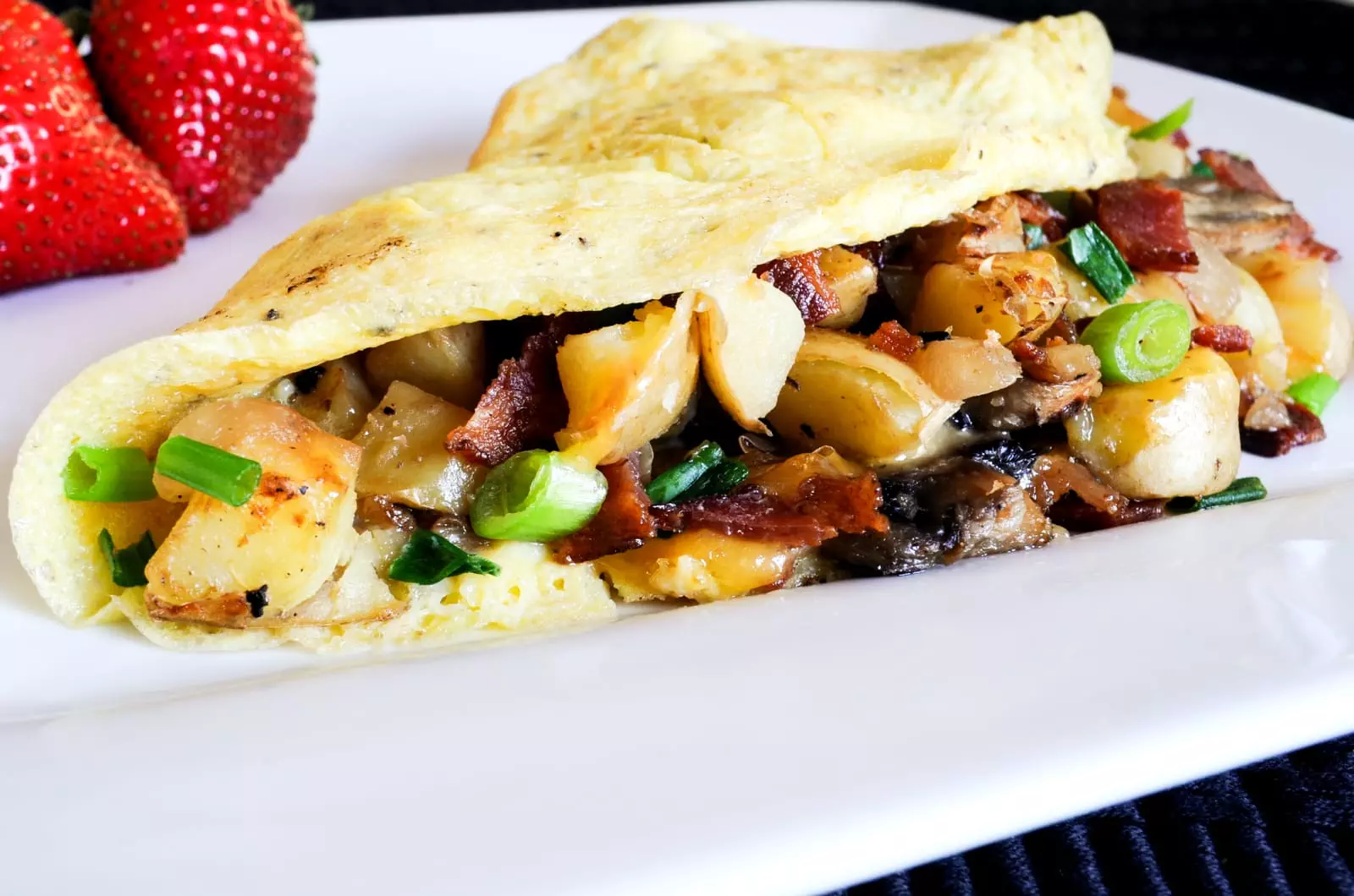 Peasant Omelet with Potatoes, Mushrooms, Bacon, and Cheddar