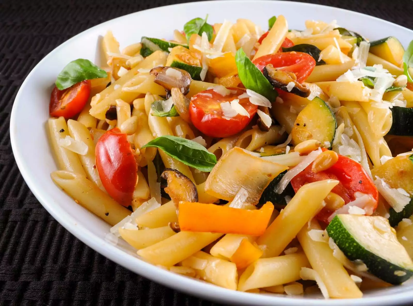 Penne with Mixed Vegetables, Parmesan Cheese, and Pine Nuts