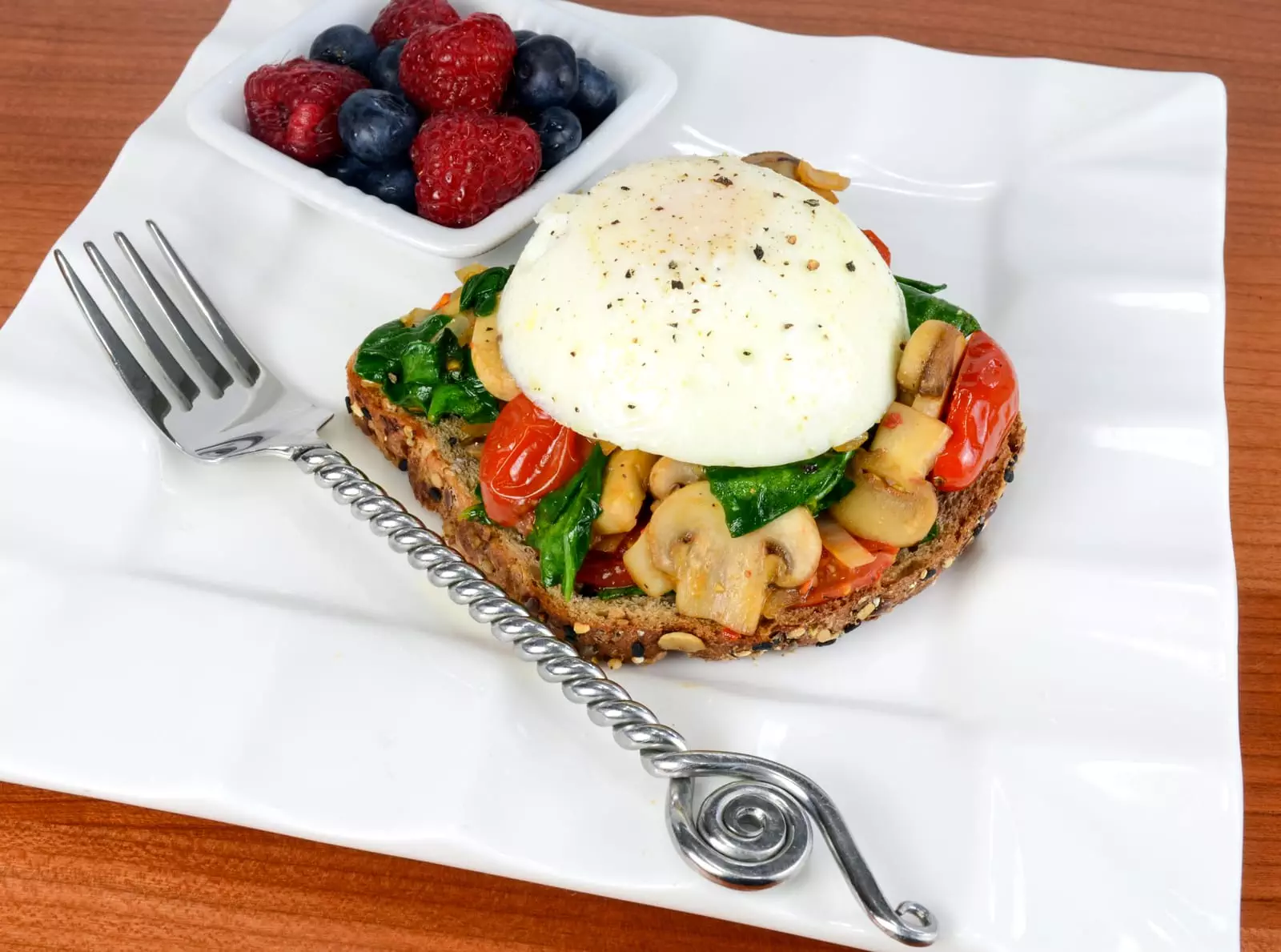 Poached Egg on Toast with Sautéed Mushrooms, Tomatoes, and Spinach