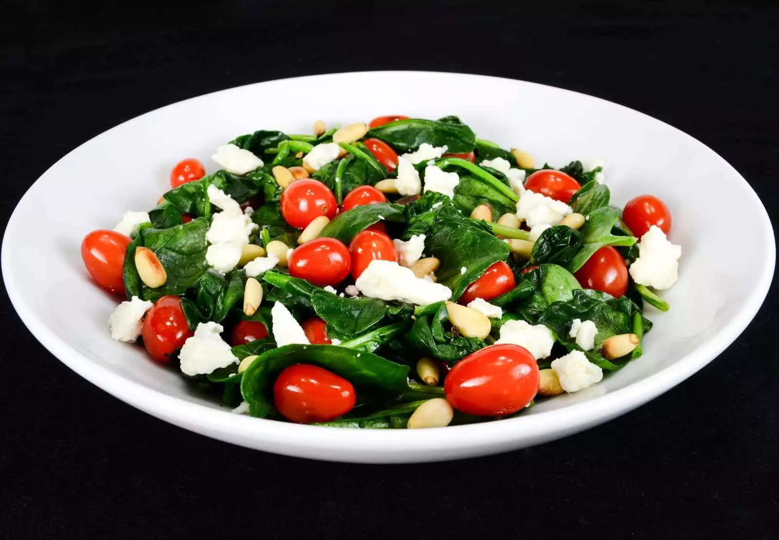 Spinach Sauté with Grape Tomatoes, Feta Cheese, and Toasted Pine Nuts