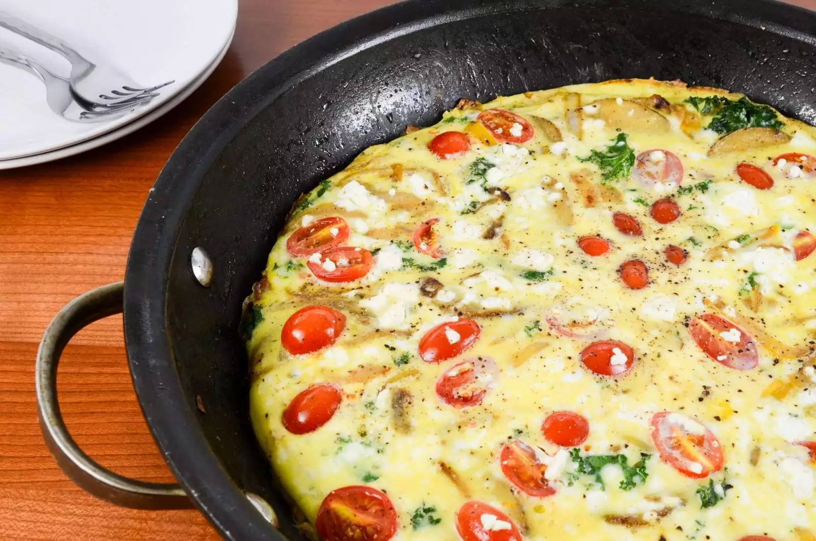 Baked Spanish Tortilla with Potato, Bell Pepper, Onion, Kale, Tomato, and Feta