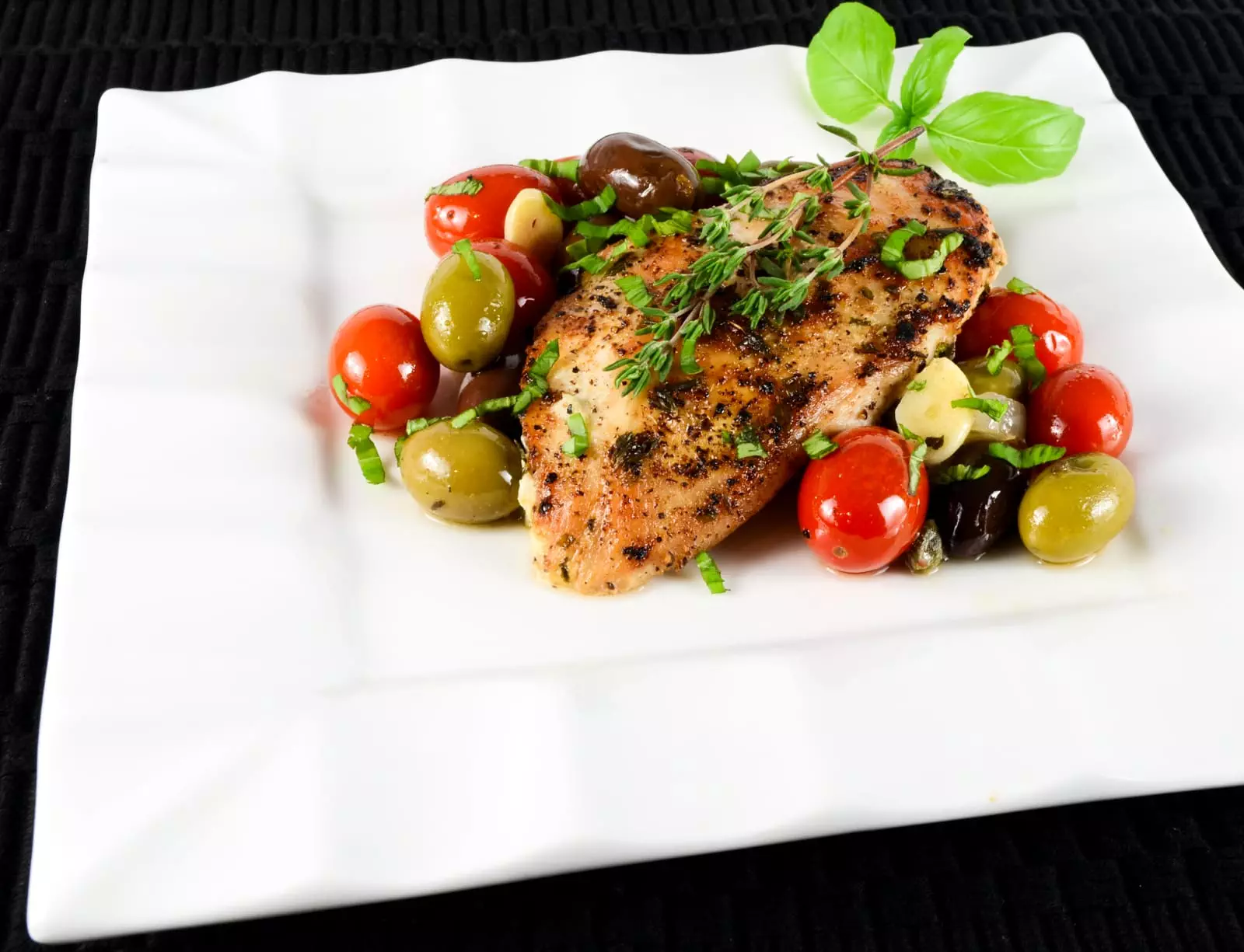 Baked Mediterranean Chicken Breasts with Tomatoes, Olives, Capers, and Garlic