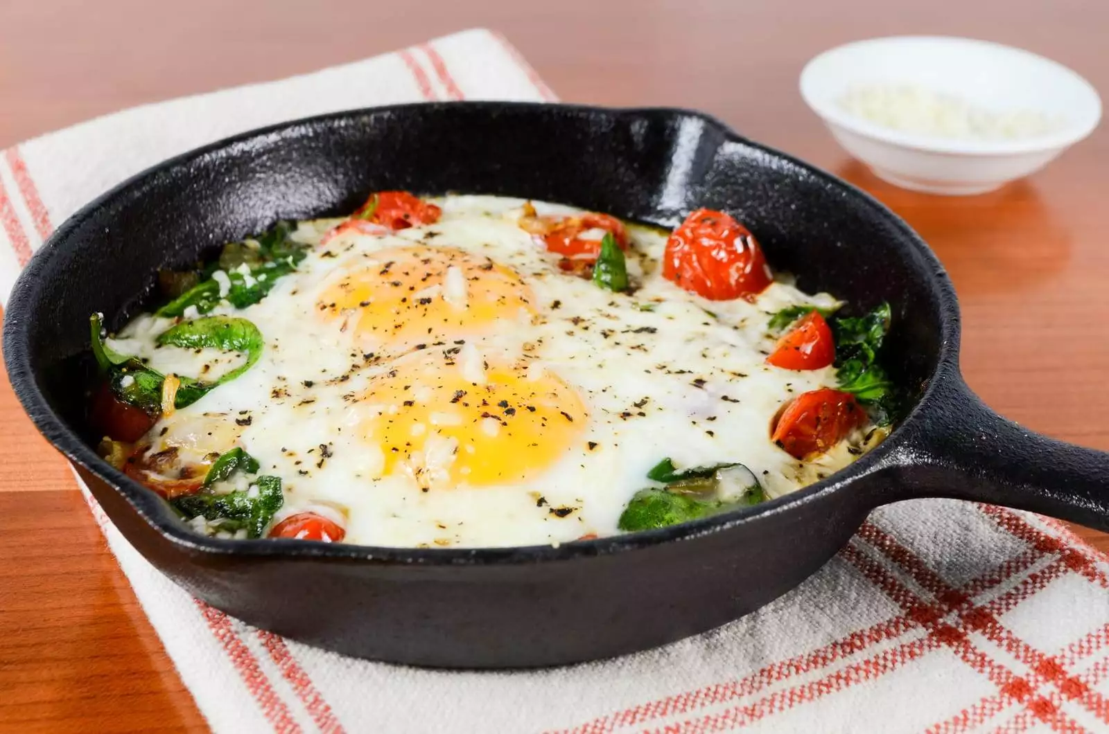 Baked Eggs with Sautéed Onions, Tomatoes, and Spinach