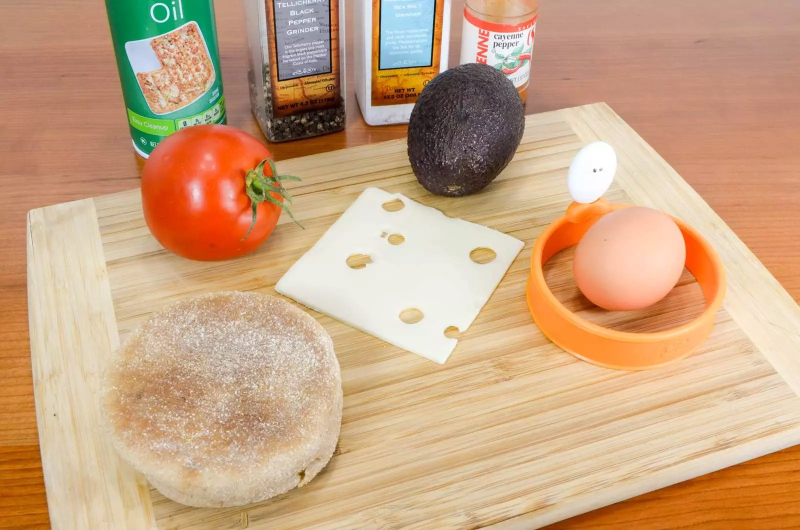 Breakfast Sandwich with Egg, Avocado, Tomato, and Swiss Cheese