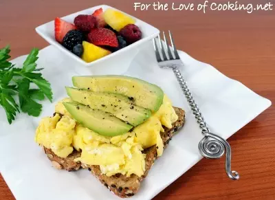 Fluffy Scrambled Eggs and Avocado Slices on Toast