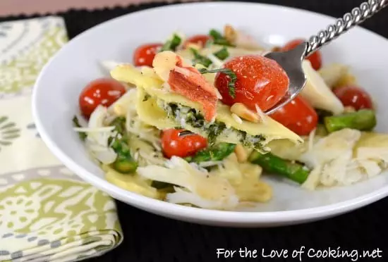 Spinach and Ricotta Ravioli topped with Asparagus and Tomato Sauté with Fresh Crab and Parmesan