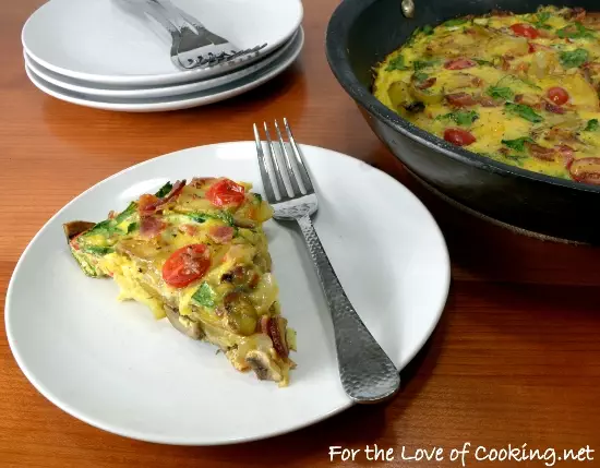 Baked Spanish Tortilla with Potato, Bacon, Onion, Mushroom, Tomato, Spinach, and Sharp Cheddar