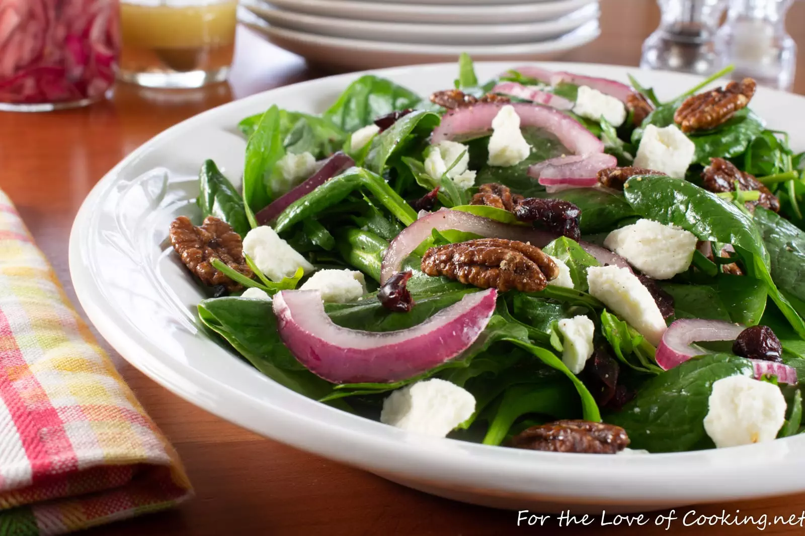 Spinach & Arugula Salad with Marinated Onion, Feta, Cranberry, and Candied Pecans