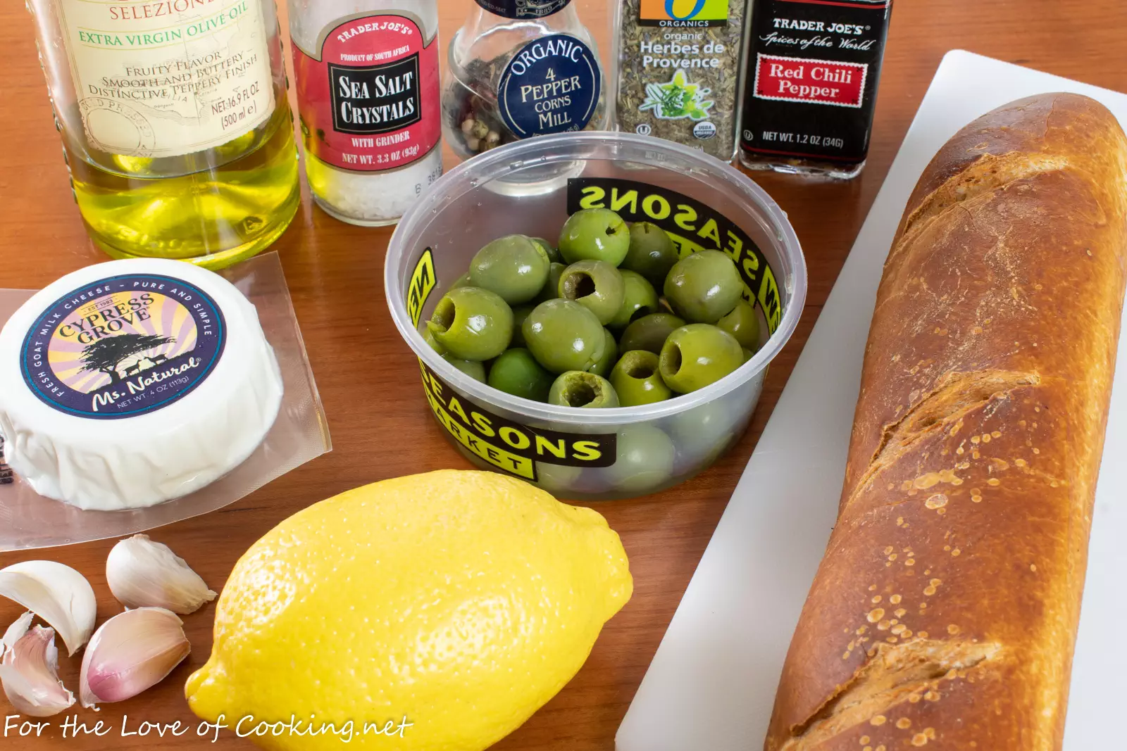 Marinated Olives & Goat Cheese with Garlic Crostini